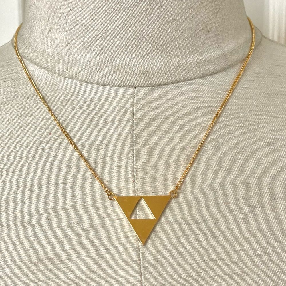 Trina Turk gold tone cut out triangle pendant necklace